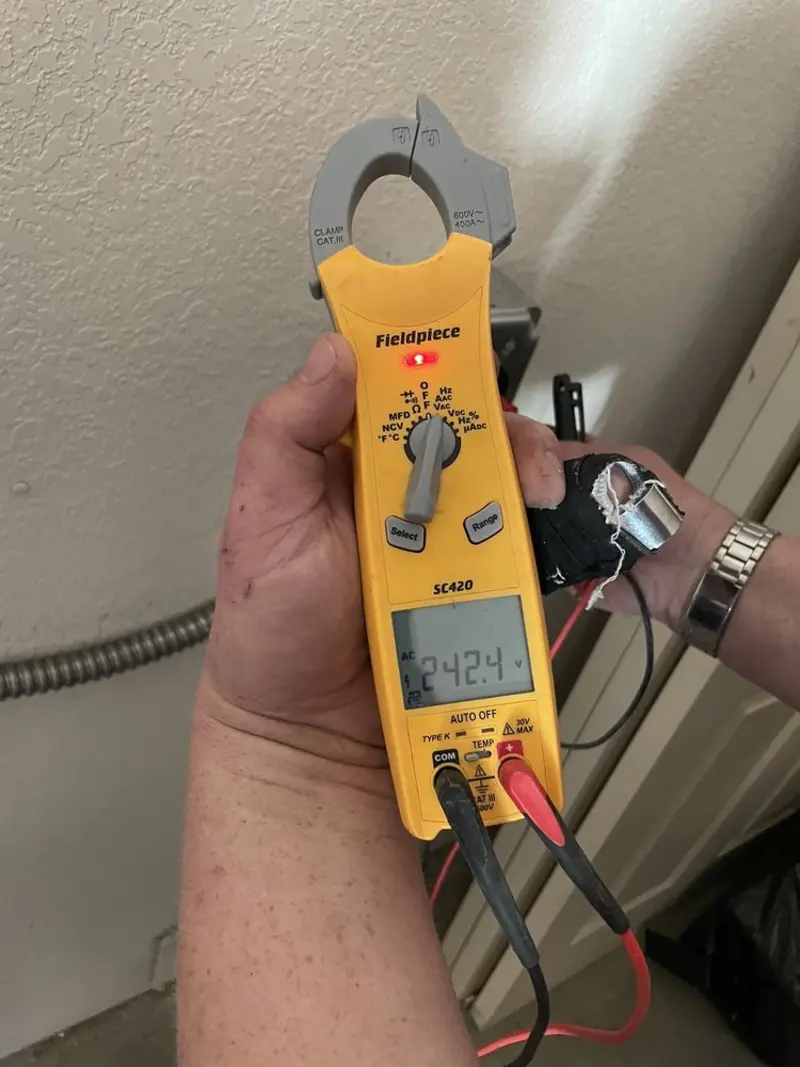 Voltage testing with clamp meter during Outlet Installation in Bloomingdale